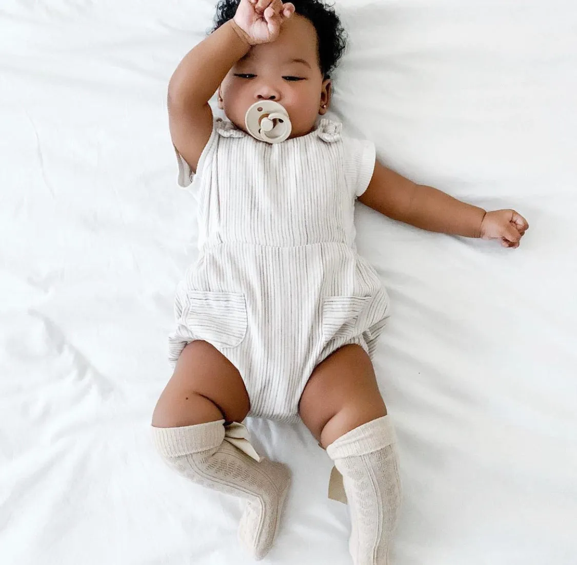 Nude knee length socks with satin bow (0-24 months)